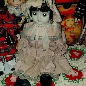 Vintage Style Porcelain Doll with Pink Dress